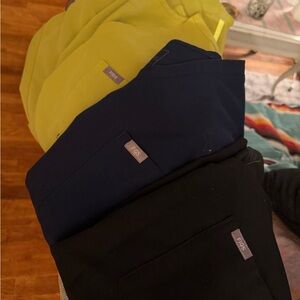 Figs Scrub Tops in Bright Yellow, Deep Blue, and Jet Black